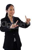 Smiling businesswoman with finger frame gesture
