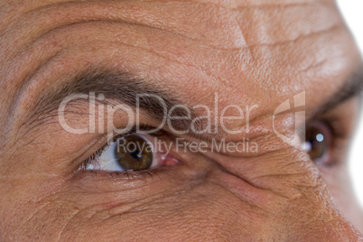 Cropped image of angry mature man looking away