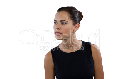 Close up of thoughtful young businesswoman looking away
