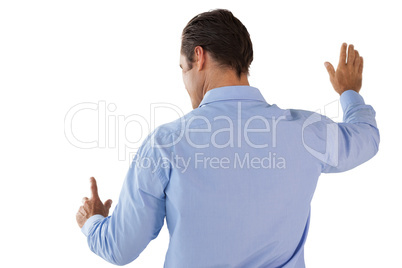 Businessman in blue shirt touching interface