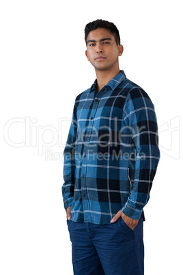 Portrait of confident young man with hands in pockets