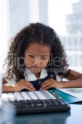 Close up of businesswoman with curly hair reading document