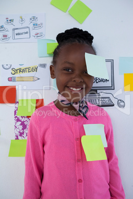 Portrait of smiling businesswoman with colorful adhesive notes