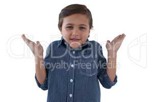 Happy boy posing against white background