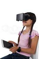 Girl using virtual reality headset and digital tablet