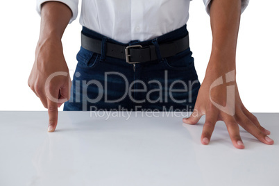 Teenage boy touching invisible screen on table