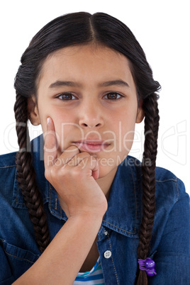 Girl with hand on chin against white background