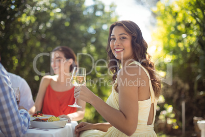 Woman holding a wine glass in restaurant