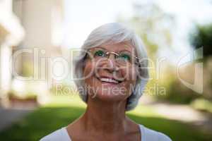 Close-up of thoughtful smiling senior woman