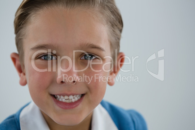 Smiling schoolboy looking at camera