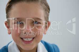 Smiling schoolboy looking at camera