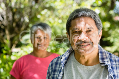 Portrait of senior couple in garden