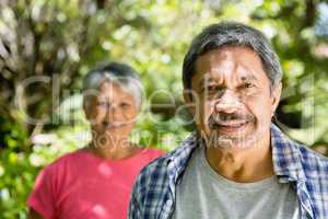 Portrait of senior couple in garden