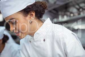 Close-up of female chef in kitchen
