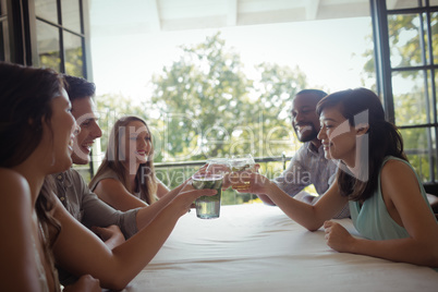 Group of friends toasting cocktail glasses