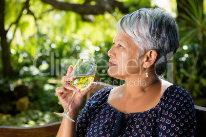 Senior woman drinking wine