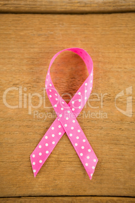 Directly above view of spotted pink Breast Cancer Awareness ribbon