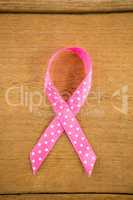 Directly above view of spotted pink Breast Cancer Awareness ribbon