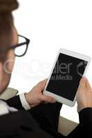 Close up of businessman using tablet computer