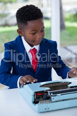 Businessman using typewriter