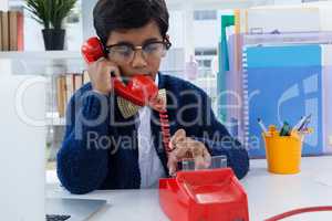 Businessman using land line phone