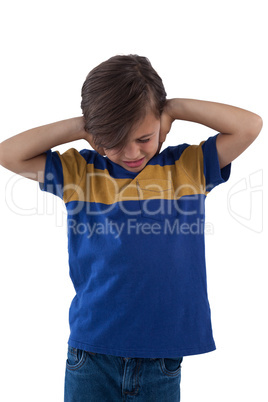Frustrated boy covering his ears