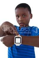 Cute boy showing his smart watch