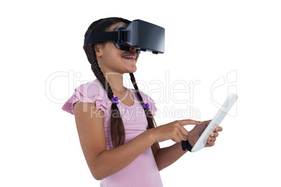 Teenage girl using virtual reality headset and digital tablet