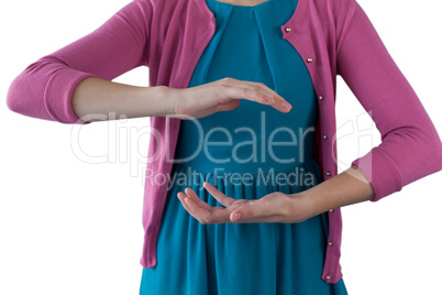 Teenage girl pretending to be hold invisible object
