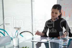 Businesswoman with file at desk