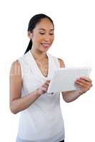 Happy young businesswoman using digital tablet