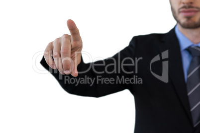 Cropped image of businessman touching index finger on invisible screen