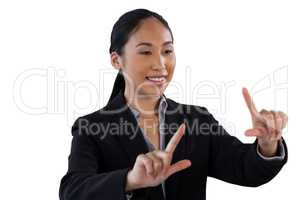 Smiling businesswoman doing finger frame gesture