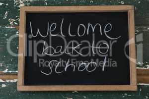 Welcome back to school text written on chalkboard