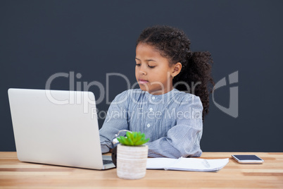 Businesswoman with curly hair using laptop computer