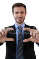 Smiling businessman showing invisible product