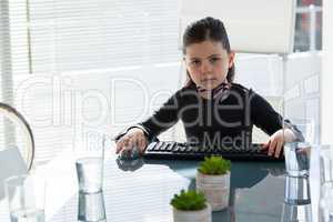 Portrait of creative businesswoman sitting at desk