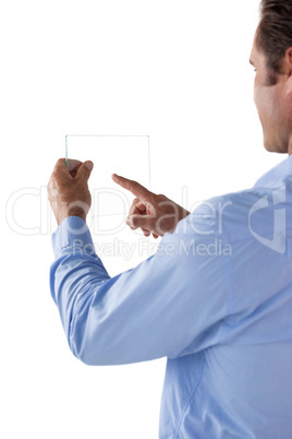 Mature businessman using glass interface Mature businessman using glass interface