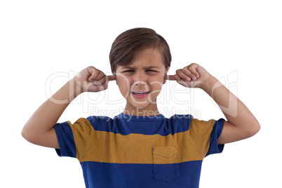 Cute boy covering his ears against white background