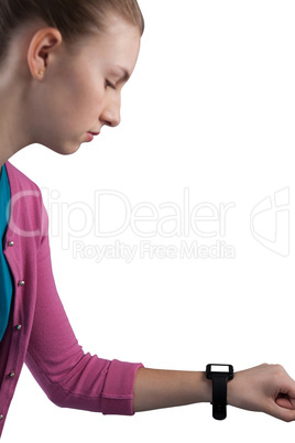 Teenage girl looking her smartwatch Teenage girl looking her smartwatch