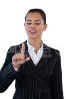 Businesswoman in suit touching invisible interface