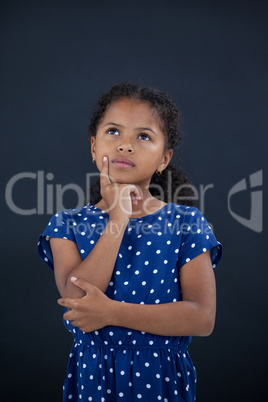 Girl with hand on chin