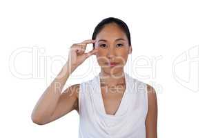 Portrait of businesswoman adjusting invisible eyeglasses