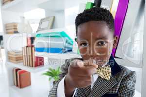 Portrait of businessman pointing