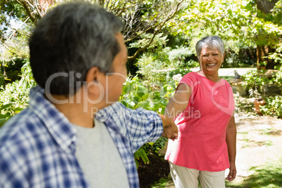 Happy senior couple enjoying in garden