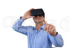 Businessman pointing while using virtual reality simulator