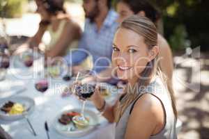 Woman holding a wine glass in restaurant