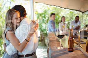 Couple embracing each other at counter