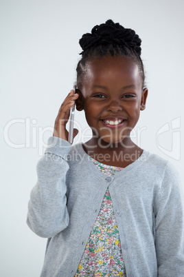 Portrait of happy businesswoman talking on phone