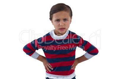 Cute boy standing with hand on hip